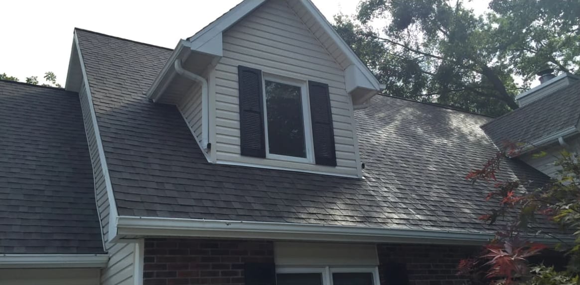 The same roof and dormer after soft wash roof cleaning in Jefferson City, MO, the streaks gone
